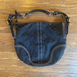 Black signature canvas print Coach shoulder bag.